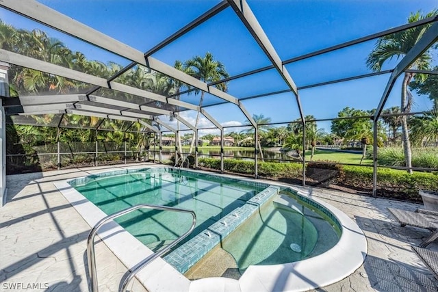 view of swimming pool with an in ground hot tub, a patio, and a lanai