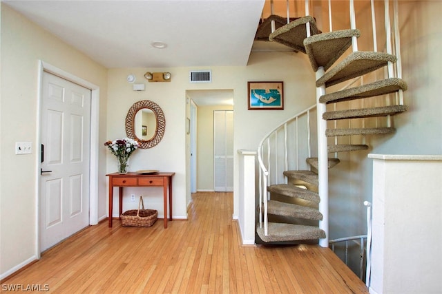 entryway with hardwood / wood-style flooring