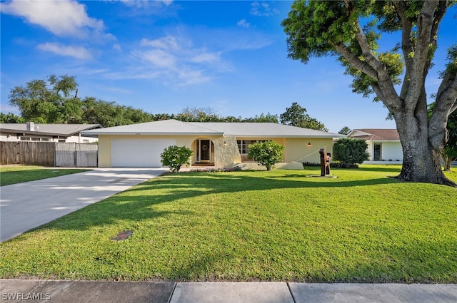 single story home with a front lawn and a garage