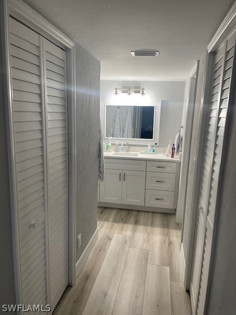 bathroom featuring vanity and hardwood / wood-style flooring