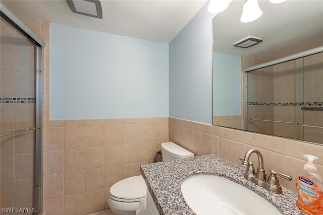 5600 Bonita Beach Rd SW Unit 4606, Bonita Springs, FL 34134 - full bathroom with visible vents, tile walls, a stall shower, vanity, and toilet