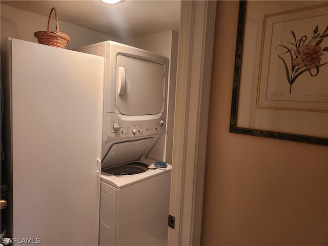 laundry room featuring stacked washer / dryer