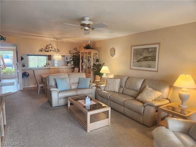 living room with ceiling fan and carpet flooring