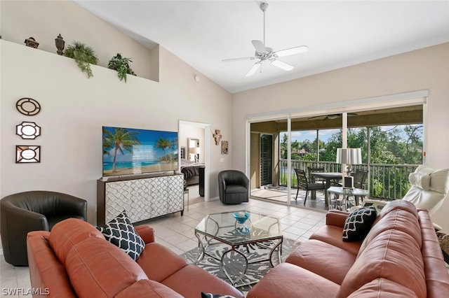 living room featuring ceiling fan, light tile patterned flooring, and high vaulted ceiling