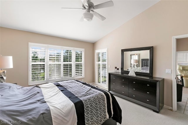 bedroom with light carpet, lofted ceiling, and ceiling fan