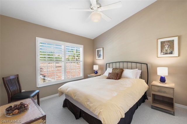 bedroom featuring lofted ceiling, light colored carpet, and ceiling fan