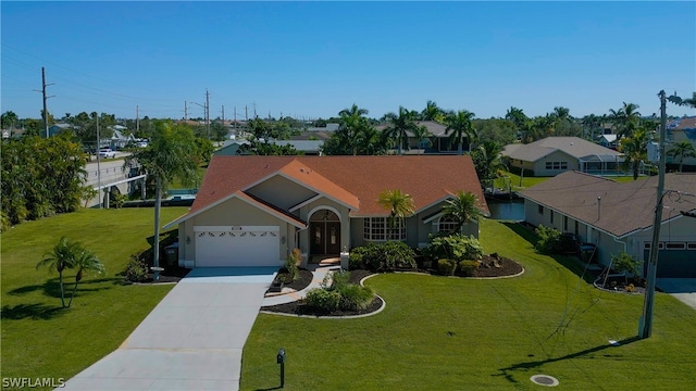 view of front facade with a front yard and a garage