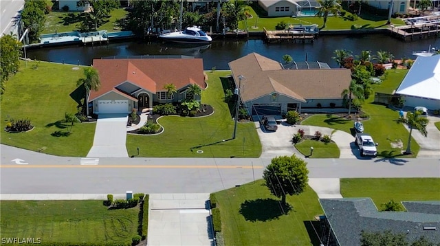 birds eye view of property featuring a water view