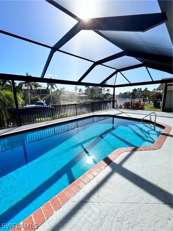 view of pool with a lanai and a patio