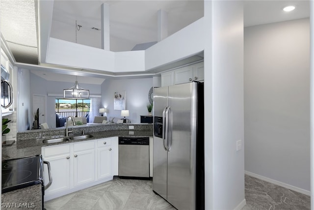 kitchen featuring sink, appliances with stainless steel finishes, white cabinetry, and light tile floors