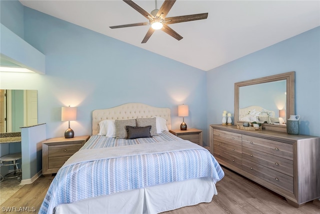 bedroom with light hardwood / wood-style floors and ceiling fan