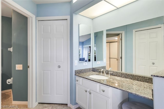 bathroom featuring vanity with extensive cabinet space