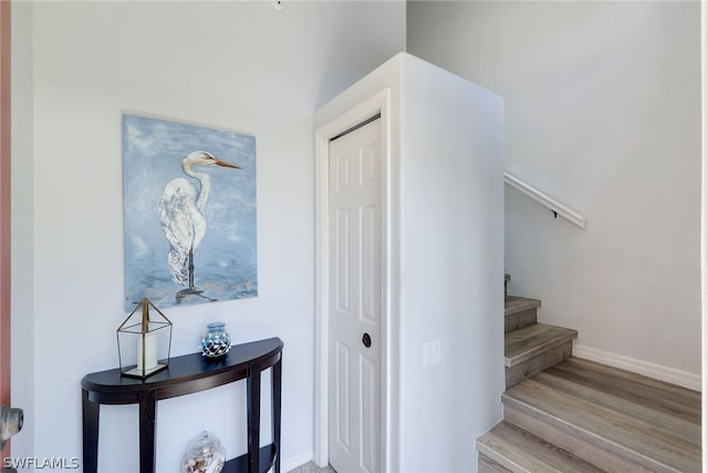 stairway featuring hardwood / wood-style floors