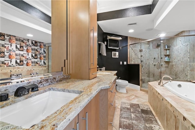 bathroom featuring tile patterned flooring, vanity, a bidet, and independent shower and bath