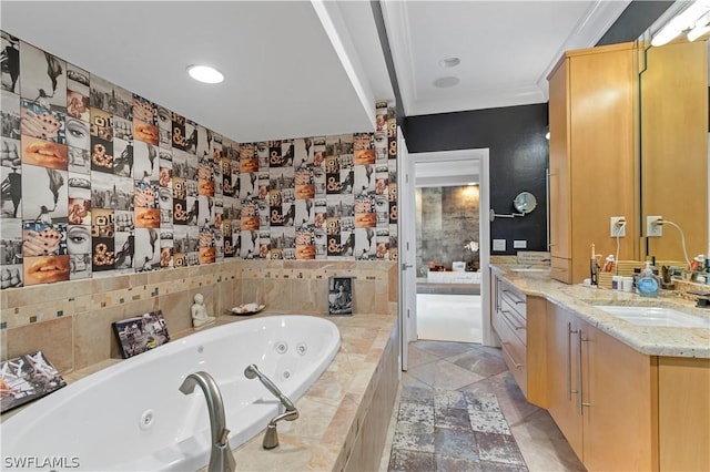 bathroom with vanity, crown molding, and tiled tub