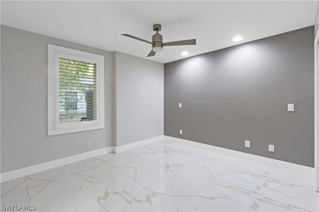 spare room featuring ceiling fan