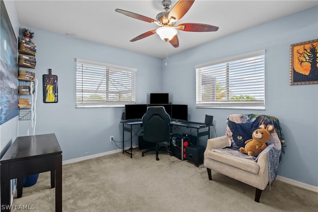 carpeted office featuring a healthy amount of sunlight and ceiling fan