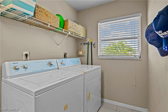 washroom with light tile patterned flooring and independent washer and dryer