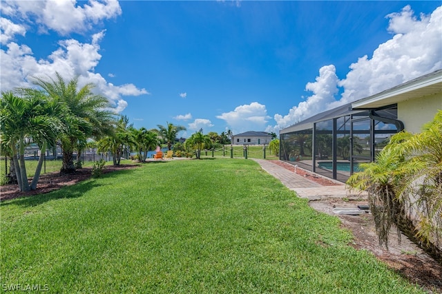 view of yard featuring a lanai