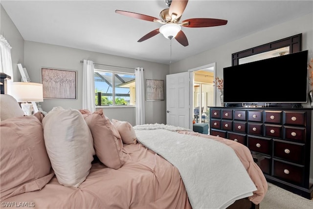 carpeted bedroom featuring ceiling fan