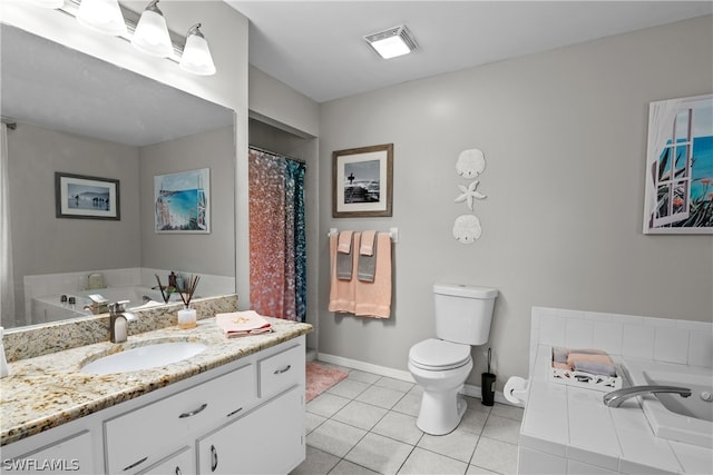 bathroom featuring tile patterned flooring, tiled bath, toilet, and vanity