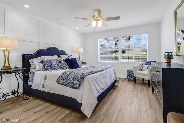 bedroom featuring light hardwood / wood-style flooring and ceiling fan