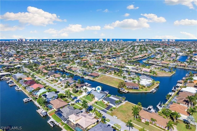 birds eye view of property featuring a water view and a residential view