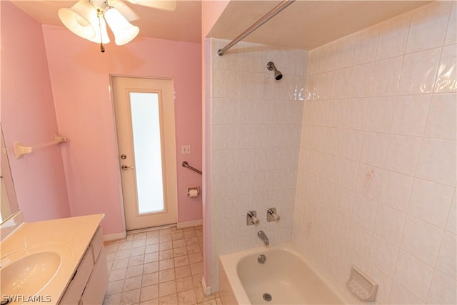 bathroom with vanity and tiled shower / bath combo