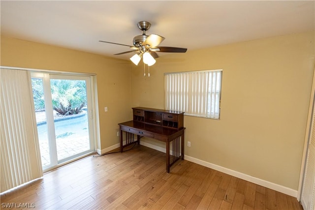 misc room with ceiling fan and light hardwood / wood-style floors