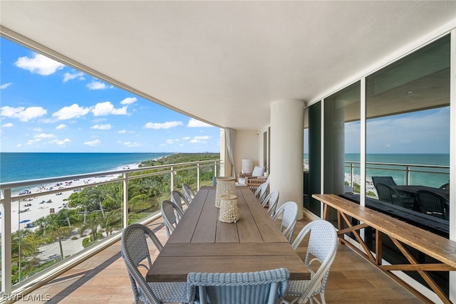 balcony with a view of the beach and a water view