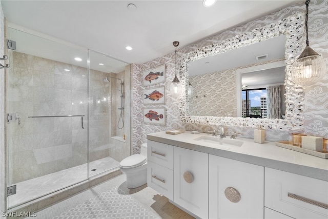 bathroom with walk in shower, large vanity, tile floors, and toilet