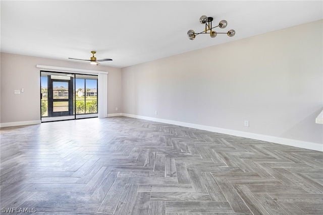 spare room with ceiling fan and parquet floors