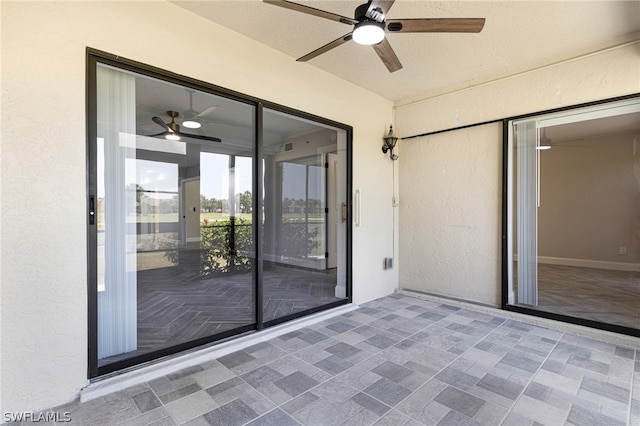 interior space with ceiling fan and tile flooring