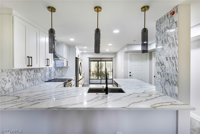 kitchen with kitchen peninsula, white cabinetry, pendant lighting, and light stone countertops