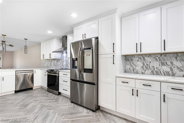 kitchen featuring stainless steel appliances, tasteful backsplash, light parquet flooring, wall chimney range hood, and white cabinets