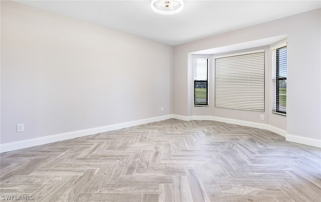 spare room with light parquet flooring