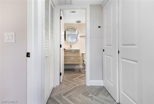 hallway with light parquet floors