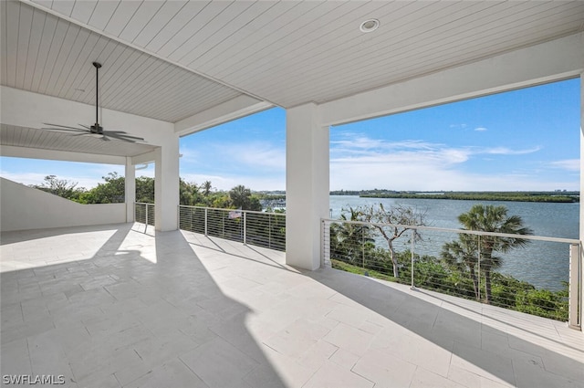 view of patio featuring ceiling fan and a water view