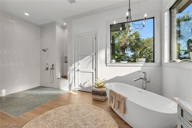 bathroom with a notable chandelier, a healthy amount of sunlight, wood-type flooring, and plus walk in shower