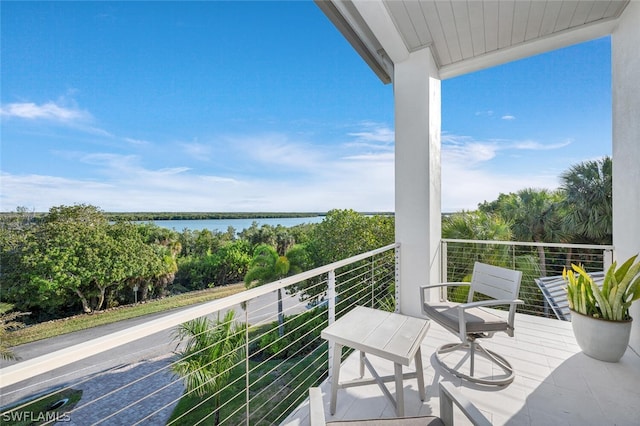 balcony featuring a water view