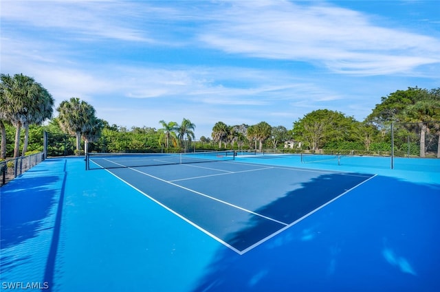 view of tennis court featuring basketball court