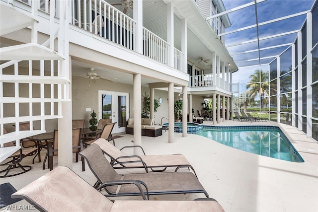 view of pool with a patio area, french doors, and ceiling fan