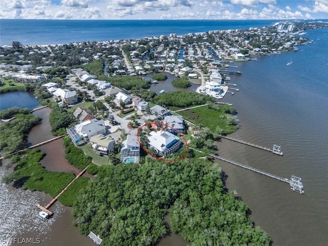 birds eye view of property with a water view