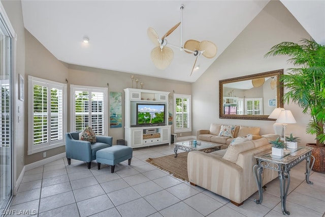 living room with high vaulted ceiling and light tile floors