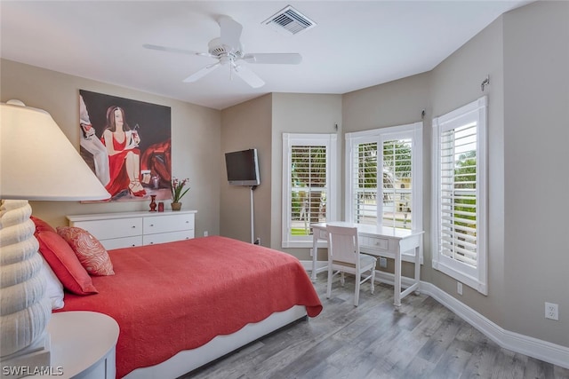 bedroom featuring ceiling fan and hardwood / wood-style flooring