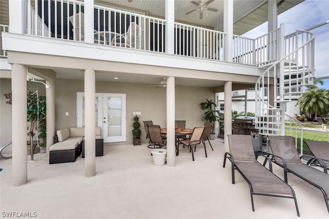 view of patio featuring grilling area, ceiling fan, an outdoor hangout area, and a balcony