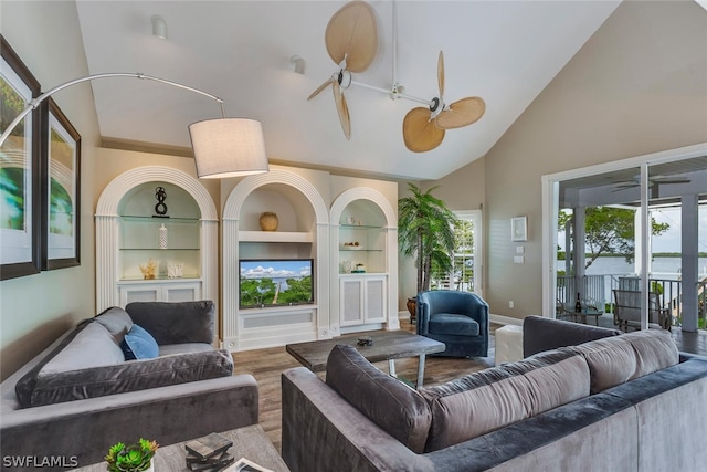 living room featuring high vaulted ceiling, built in features, wood-type flooring, and ceiling fan