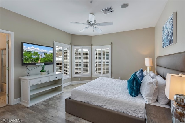 bedroom featuring ceiling fan and hardwood / wood-style flooring