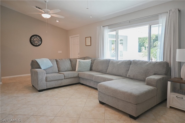 living room featuring vaulted ceiling, ceiling fan, and light tile floors