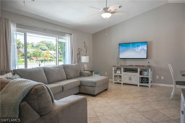 tiled living room with lofted ceiling and ceiling fan